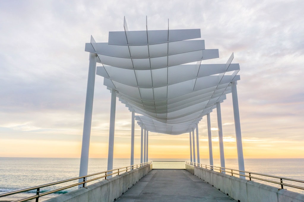 An architectural viewing platform resembling a white sail overlooking the ocean on Marine Parade in Napier.