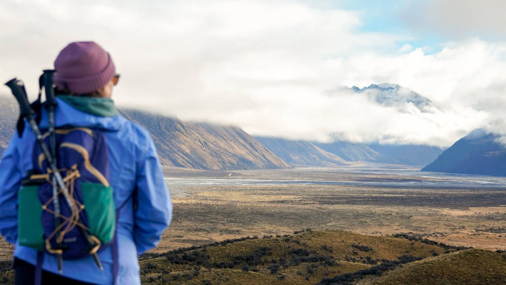 Jac from Weekend Path at Mount Sunday (Edoras), looking out over the valley and mountains from the summit.