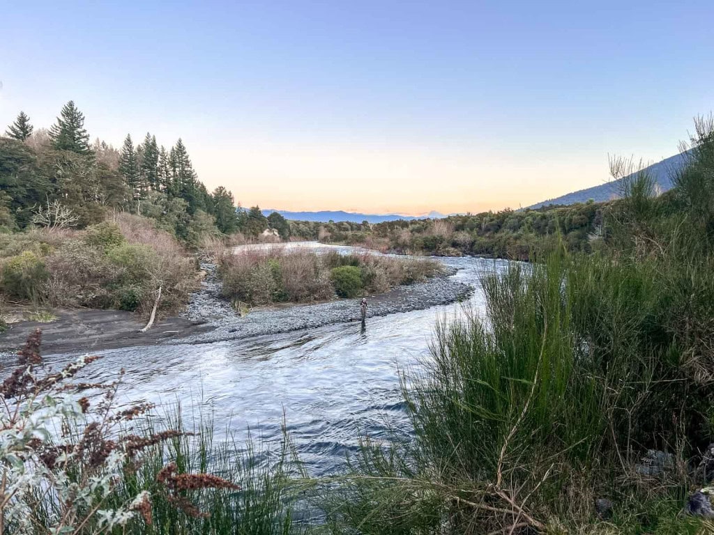 Ty from Weekend Path fly fishing on the Tongariro River in Turangi at sunset.